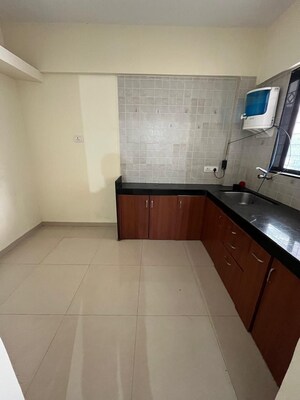 Kitchen in 2 BHK Apartment at Sharada Spandan Apartments, Warje – for Rent
