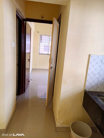Building Lobby in 1 BHK Apartment at Omkar Blossom, Wagholi – for Rent