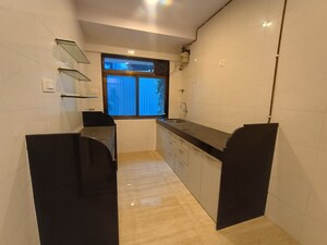 Kitchen in 2 BHK Apartment at Raunak Centrum, Sion East – for Sale