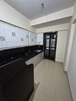 Kitchen in 1 BHK Apartment at Thakur Gayatri Satsang, Kandivali East – for Sale