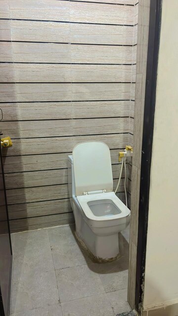 Bathroom in 2.5 BHK Apartment at Aims Golf City, Sector 75 – for Rent