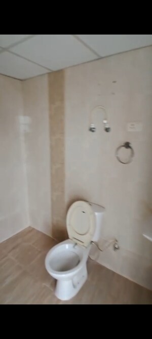 Bathroom in 2 BHK Apartment at Charms Castle, Raj Nagar Extension – for Rent