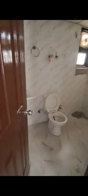 Bathroom in 2 BHK Apartment at Charms Castle, Raj Nagar Extension – for Rent