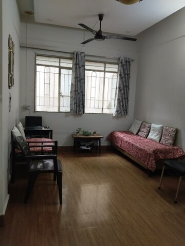 Living Room in 1.5 BHK Apartment at Rambaug Colony – for Sale