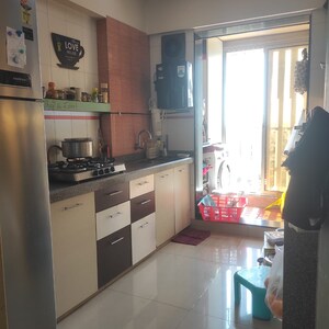 Kitchen in 2 BHK Apartment at Pearl Heights, Yari Road – for Sale