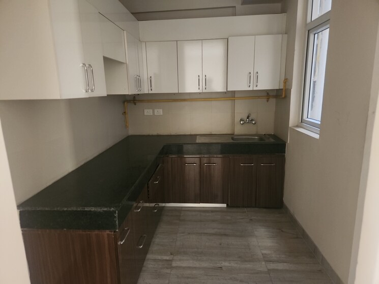Kitchen, wave-executive-floors 2 Bedroom 900 Sq.Ft. Apartment In Wave City Ghaziabad 9213142