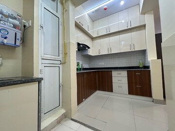 Kitchen in 2 BHK Apartment at La Residentia, Tech Zone 4 Greater Noida – for Rent