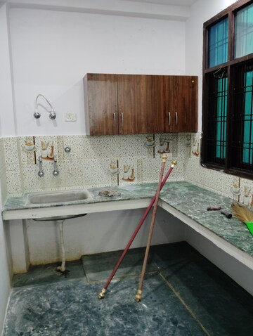 Kitchen in 1.5 BHK Independent House at Adil Nagar – for Sale