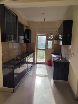 Kitchen in 2 BHK Apartment at Aims Golf City, Sector 75 – for Rent