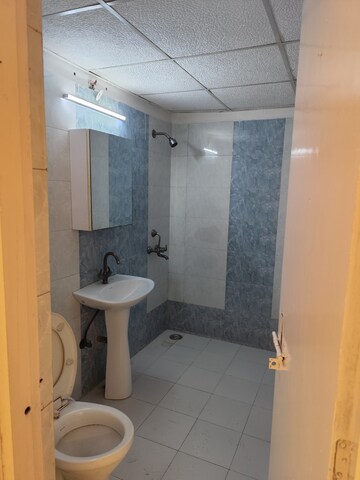 Bathroom in 4 BHK Apartment at Aims Golf City, Sector 75 – for Rent
