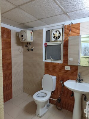 Bathroom in 4 BHK Apartment at Aims Golf City, Sector 75 – for Rent