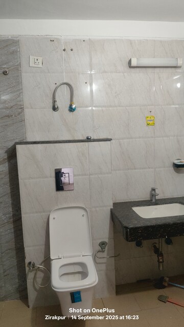Bathroom in 4 BHK Apartment at Dhakoli – for Sale