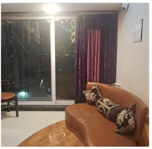 Living Room in 1.5 BHK Apartment at DLH New Chandra CHS, Andheri West – for Sale