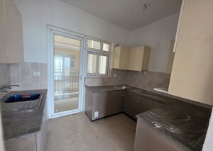 Kitchen in 4 BHK Apartment at Dev Sai Sports Home, Sector 1 Greater Noida – for Rent