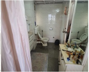 Bathroom in 2 BHK Apartment at Andheri CHS, Andheri West – for Rent