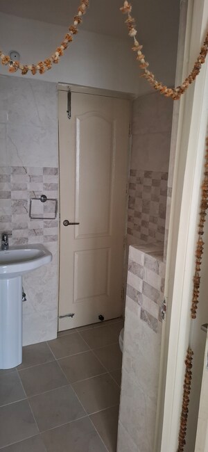 Bathroom in 3 BHK Apartment at RG Euphoria, Vrindavan Yojna – for Rent