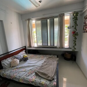 Bedroom in 2 BHK Apartment at Swastik Plaza Juhu, Vallabh Nagar Society – for Rent