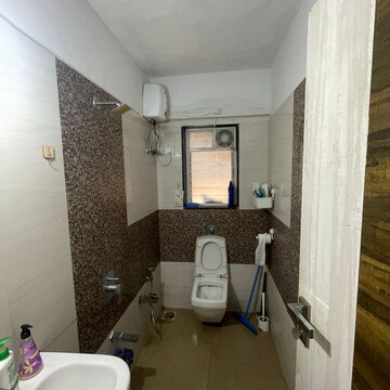 Bathroom in 2 BHK Apartment at Swastik Plaza Juhu, Vallabh Nagar Society – for Rent