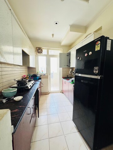 Kitchen in 3 BHK Apartment at Aims Golf City, Sector 75 – for Rent