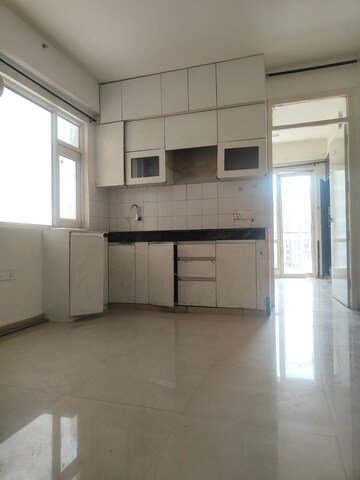 Kitchen in 1.5 BHK Apartment at ROF Aalayas, Sector 102 – for Rent