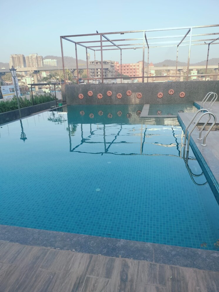 Swimming Pool, man-opus 2 Bedroom 692 Sq.Ft. Apartment In Mira Road Thane 9218333