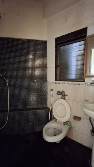Bathroom in 3 BHK Apartment at Bredco New Viceroy Park , Kandivali East – for Rent