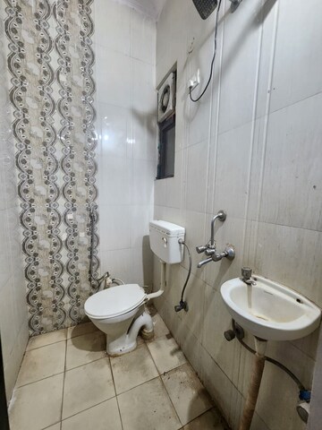 Bathroom in 2 BHK Builder Floor at Chattarpur – for Rent