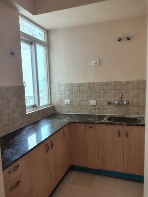 Kitchen in 2 BHK Apartment at Amrapali Dream Valley, Tech Zone 4 Greater Noida – for Rent