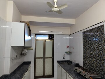 Kitchen in 2 BHK Apartment at Asmita Sand Dunes, Malad West – for Rent