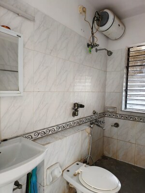 Bathroom in 2 BHK Apartment at K Raheja Palm Spring, Malad West – for Rent