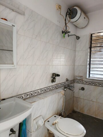 Bathroom in 2 BHK Apartment at K Raheja Palm Spring, Malad West – for Rent
