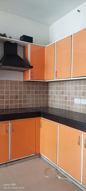 Kitchen in 3 BHK Apartment at Mahagun Mywoods, Sector 16c Greater Noida – for Rent