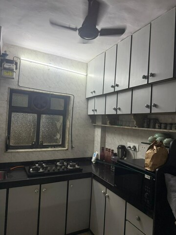 Kitchen in 2 BHK Apartment at Rajmatha CHS, Andheri West – for Rent