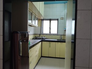 Kitchen in 2 BHK Apartment at Oshiwara Mhada, Andheri West – for Rent
