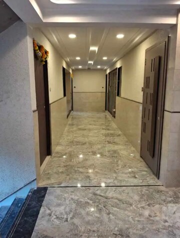 Building Lobby in 1 BHK Apartment at Satyam Gulmohar Park, Taloja Sector 26 – for Rent