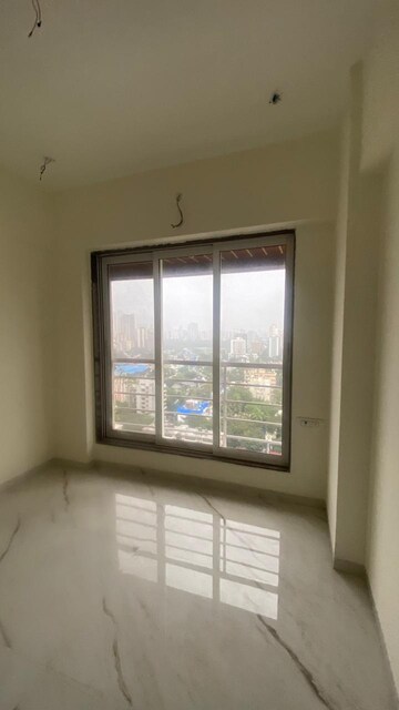 Room in 2 BHK Apartment at Ladiwala Bhavan, Kandivali West – for Sale