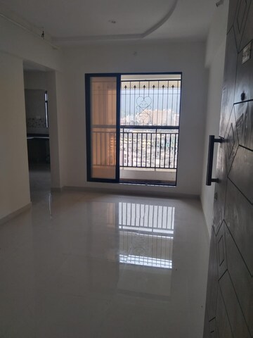 Living Room in 1 BHK Apartment at Raj Tulsi City, Badlapur East – for Rent