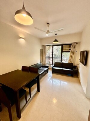 Living Room in 1 BHK Apartment at Trailokya Apartment Khar, Khar West – for Rent