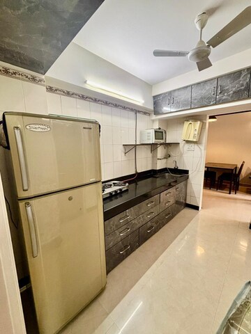 Kitchen in 1 BHK Apartment at Trailokya Apartment Khar, Khar West – for Rent