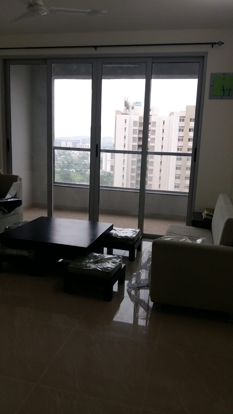 Living Room, amanora-future-towers 2 Bedroom 828 Sq.Ft. Apartment In Hadapsar Pune 9221359