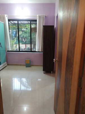 Bedroom in 2 BHK Apartment at New Heritage CHS, Dahisar West – for Rent