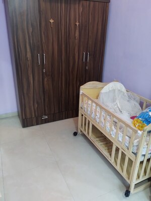 Bedroom in 2 BHK Apartment at New Heritage CHS, Dahisar West – for Rent