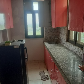 Kitchen in 2 BHK Apartment at Apex Our Homes, Garoli Kalan – for Rent