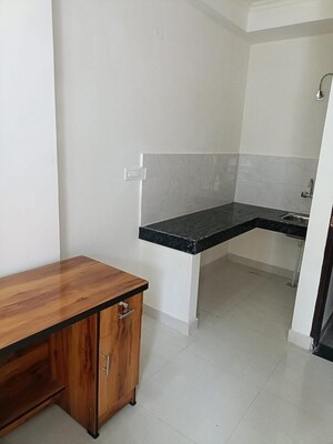 Kitchen in 1 RK Apartment at Ambience Creacions, Sector 22 – for Rent