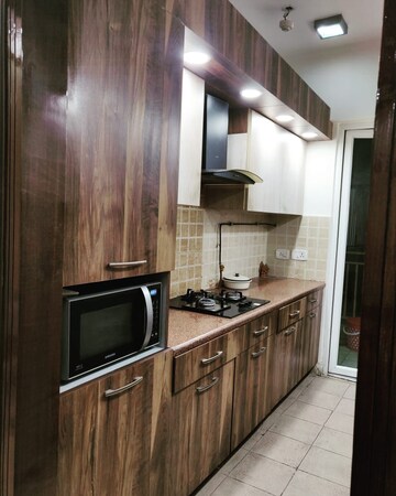 Kitchen in 2.5 BHK Apartment at Mahagun Moderne, Sector 78 – for Sale