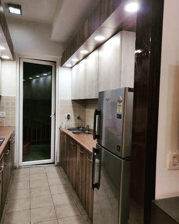 Kitchen in 2.5 BHK Apartment at Mahagun Moderne, Sector 78 – for Sale