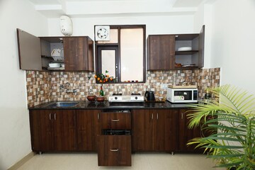 Kitchen in 1 BHK Apartment at MVL IPark, Sector 15 – for Rent