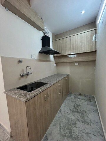 Kitchen in 1 RK Apartment at Ambience Creacions, Sector 22 – for Rent