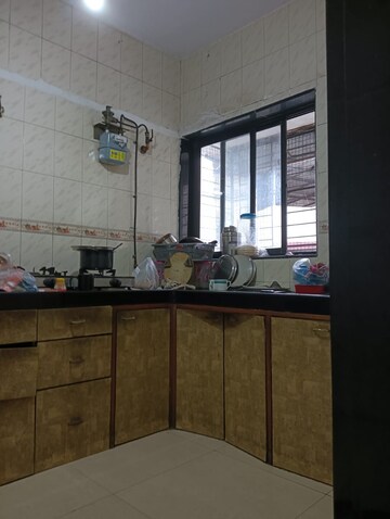 Kitchen in 2 BHK Apartment at Rajnigandha CHS Vasant Vihar, Vasant Vihar – for Sale