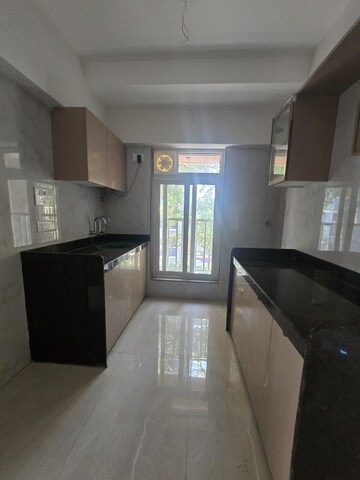 Kitchen in 2 BHK Apartment at Andheri CHS, Andheri West – for Rent